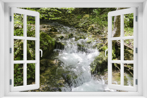 Fototapeta Naklejka Na Ścianę Okno 3D - Beautiful mountain stream with a waterfall, in spring forest 