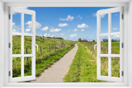 Fototapeta Naklejka Na Ścianę Okno 3D - Panorama of a bicycle path along a dike near Garnwerd