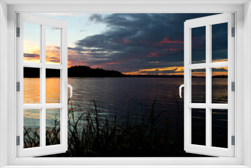 Fototapeta Naklejka Na Ścianę Okno 3D - Heavy colorful sky above lake during the sunset time near Ikaalinen Finland