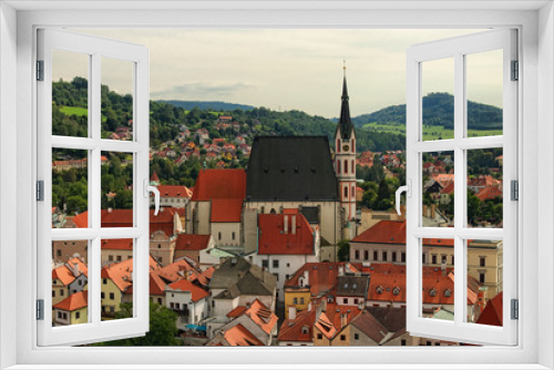 Cityscape with red tile roofs. Church of Saint Vitus- UNESCO World Heritage Site. Cesky Krumlov (Krumau), Czech Republic