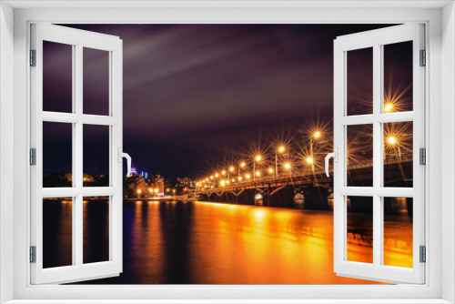 Fototapeta Naklejka Na Ścianę Okno 3D - Illuminated Chernavsky bridge at night, view to right bank or downtown of Voronezh city, dramatic cityscape with reflection