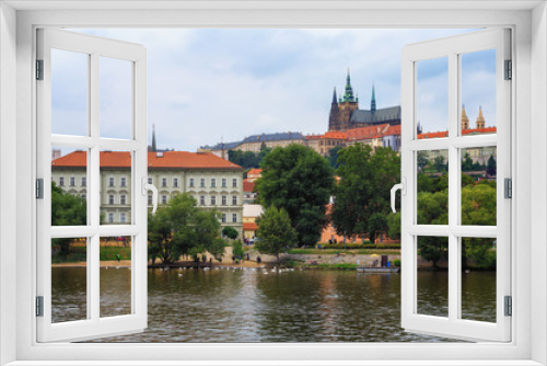 Fototapeta Naklejka Na Ścianę Okno 3D - The view of Prague castle from the other bank of the Vltava river.