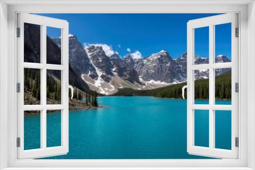 Fototapeta Naklejka Na Ścianę Okno 3D - Beautiful turquoise waters of the Moraine Lake with snow-covered peaks above it in Rocky Mountains, Banff National Park, Canada.