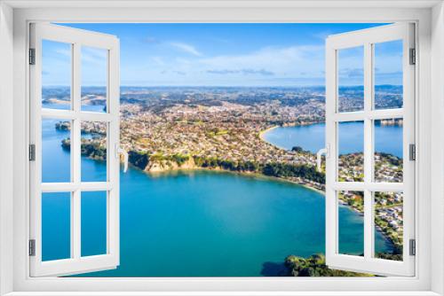 Fototapeta Naklejka Na Ścianę Okno 3D - Aerial view on residential suburbs surrounded by sunny ocean harbour. Whangaparoa peninsula, Auckland, New Zealand