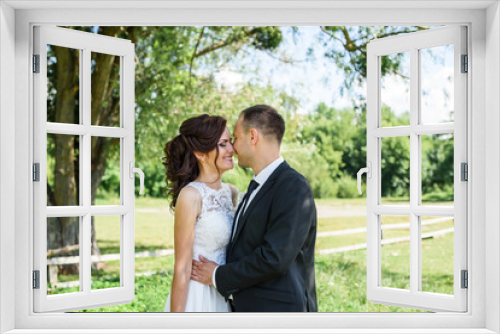 Portrait of a young couple. Wedding photo outdoor of loving couple