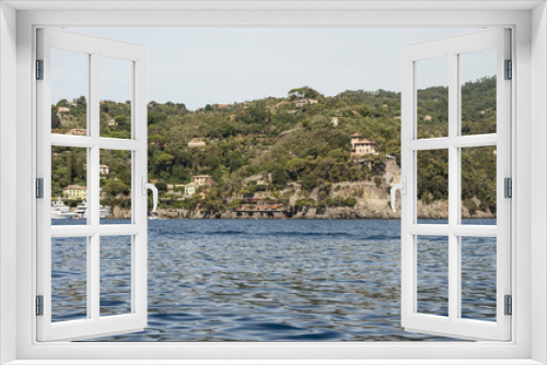 Fototapeta Naklejka Na Ścianę Okno 3D - Portofino, Liguria Italia - watching the coast from the sea. View of the villas of Portofino, one of the most popular village on the Italian Riviera.