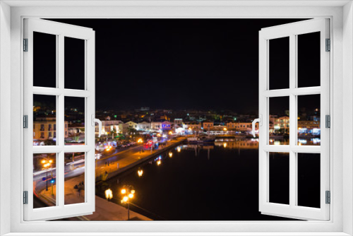 Fototapeta Naklejka Na Ścianę Okno 3D - Amazing view of the port and the city of Mytilene at night.Mytilene is the capital and port of the island of Lesvos and also the biggest island of the North Aegean.