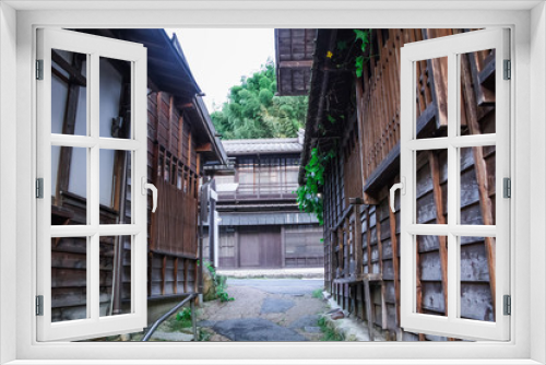 Fototapeta Naklejka Na Ścianę Okno 3D - Kiso valley is the old  town or Japanese traditional wooden buildings for the travelers walking at historic old street  in Narai-juku , Nagano Prefecture, JAPAN.