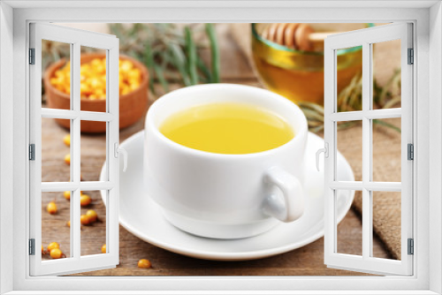 Fototapeta Naklejka Na Ścianę Okno 3D - sea-buckthorn tea in a cup