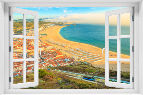 Fototapeta Naklejka Na Ścianę Okno 3D - View of Nazare cabins train Funicular. Nazare in Portugal is the most popular seaside resorts in Atlantic coast. Nazare Skyline and beach waterfront from Nazare Sitio.