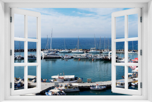 Fototapeta Naklejka Na Ścianę Okno 3D - View on port of Vlichada town full with small fishing boats at Santorini island