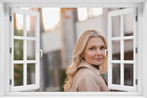 woman in trench coat outdoors