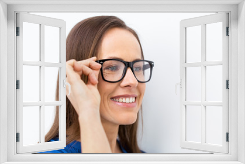 close up of smiling middle aged woman in glasses