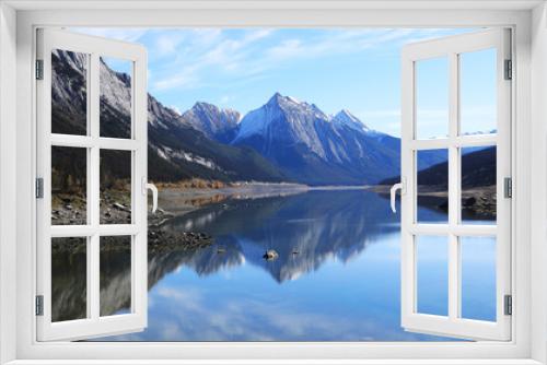 Fototapeta Naklejka Na Ścianę Okno 3D - Reflections on a tranquil lake view in the Rocky Mountains