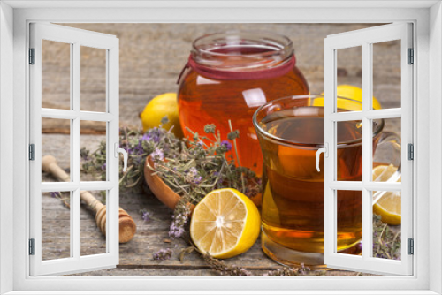 Fototapeta Naklejka Na Ścianę Okno 3D - Natural domestic organic tea from wild mint and honey on a rustic table