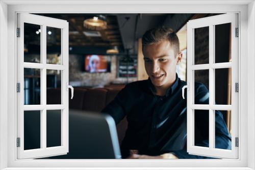 cafe, man in black shirt, laptop