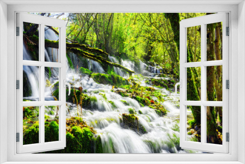 Fototapeta Naklejka Na Ścianę Okno 3D - Amazing waterfall with crystal clear water among green woods