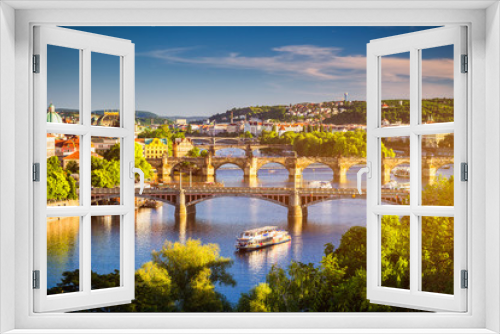 Fototapeta Naklejka Na Ścianę Okno 3D - View of the Vltava River and the bridges shined with the sunset sun, Prague, the Czech Republic