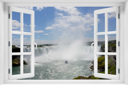 Fototapeta Naklejka Na Ścianę Okno 3D - looking up the Niagara river towards a tourist boat approaching the Horseshoe Falls, Niagara Falls, Ontario Canada