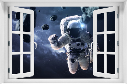 Fototapeta Naklejka Na Ścianę Okno 3D - Science fiction space wallpaper with astronaut at the spacewalk. Elements of this image furnished by NASA