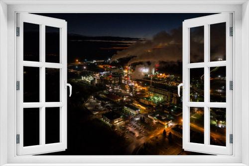Fototapeta Naklejka Na Ścianę Okno 3D - Aerial view of oil refinery. Industrial view at oil refinery plants with lots of light at night. 