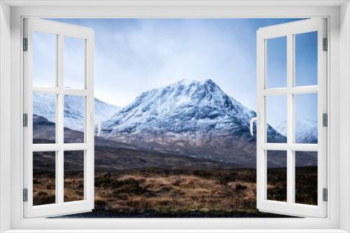 A snowy mountain in Glencoe, Scottish Highland, during a rain storm