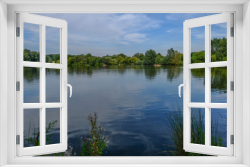 Fototapeta Naklejka Na Ścianę Okno 3D - Essex Lake with boats and reflections on the water.