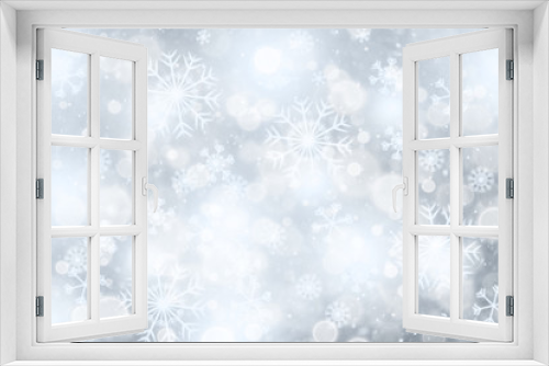 Abstract bright blue colored blurry sky with snowflakes. Copy space greeting card illustration background.