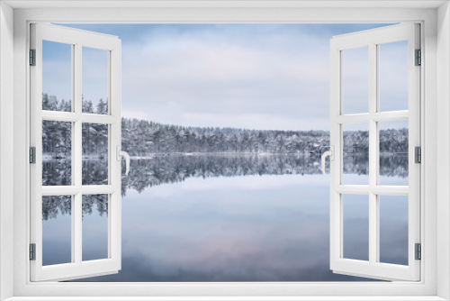 Fototapeta Naklejka Na Ścianę Okno 3D - Scenic landscape with forest and lake at winter evening in Finland