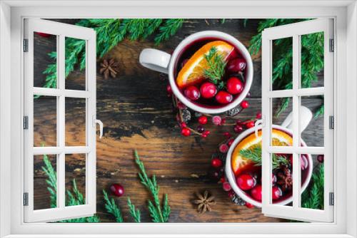 Fototapeta Naklejka Na Ścianę Okno 3D - Winter Christmas traditional drink, red mulled wine with cranberry. Fir brunches on the rustic wooden table, top view.