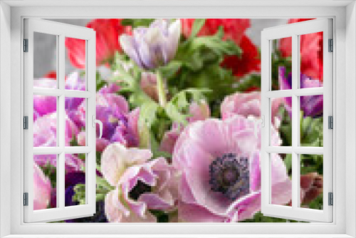 Fototapeta Naklejka Na Ścianę Okno 3D - bouquet of mixed anemones flowers in vase . the work of the florist at a flower shop.