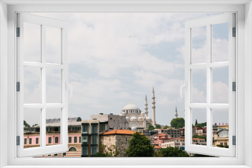 Fototapeta Naklejka Na Ścianę Okno 3D - The world-famous Blue Mosque in Istanbul is also called Sultanahmet. Near various buildings. View from the Bosphorus. Turkey.
