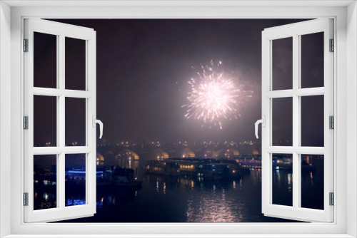 Fototapeta Naklejka Na Ścianę Okno 3D - Fireworks on New Year's Eve over ships on the Vltava River in Prague