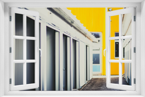 Fototapeta Naklejka Na Ścianę Okno 3D - White pavilions in a row