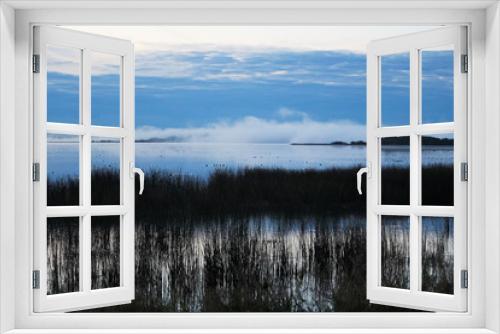 Fototapeta Naklejka Na Ścianę Okno 3D - Morning mist rising off of an Alberta lake