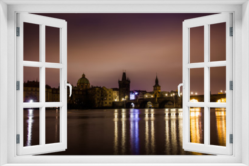 Charles bridge in Prague with lanterns at night