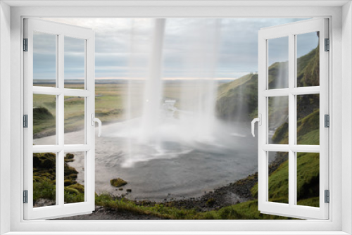 Fototapeta Naklejka Na Ścianę Okno 3D - Behind a popular waterfall in Iceland. 