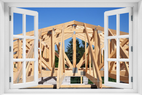 Fototapeta Naklejka Na Ścianę Okno 3D - Roof trusses. Roofing Construction House Roof Building.Timber roof truss. Trusses and Framing Home Roof.