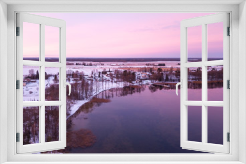 Fototapeta Naklejka Na Ścianę Okno 3D - Beautiful colorful sunrise over a half frozen lake during winter. Tartu, Estonia.