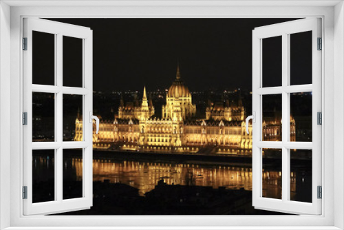 Parliament building by night illuminated by lights, Budapest, Hungary