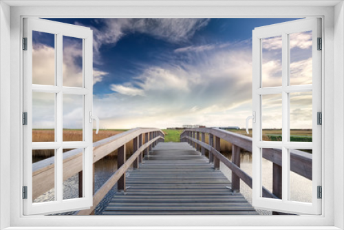Fototapeta Naklejka Na Ścianę Okno 3D - wooden bridge via river and blue sky