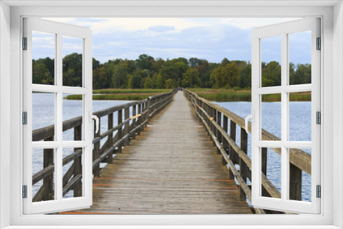 Fototapeta Naklejka Na Ścianę Okno 3D - Wooden bridge for pedestrians on Sirvenos Lake.