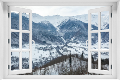 Fototapeta Naklejka Na Ścianę Okno 3D - Mountain village in the Caucasus Mountains in winter, Svaneti, Georgia