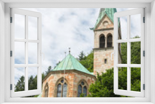 Fototapeta Naklejka Na Ścianę Okno 3D - silhouette of church with tower against mountain slope with trees in Berchtesgaden, Germany