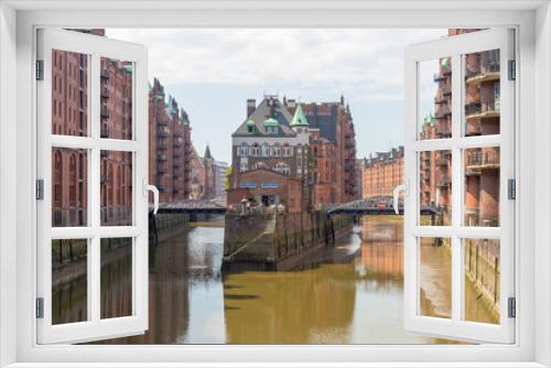 Fototapeta Naklejka Na Ścianę Okno 3D - HAMBURG, GERMANY - JULY 20, 2016: Famous water castle in Speicherstadt. Hamburg attracts 10 million people annually