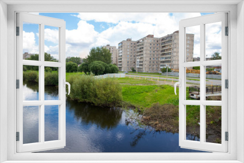 Fototapeta Naklejka Na Ścianę Okno 3D - Residential multi-storey houses on the river bank