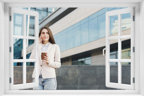 Portrait of a confident young businesswoman talking on cell