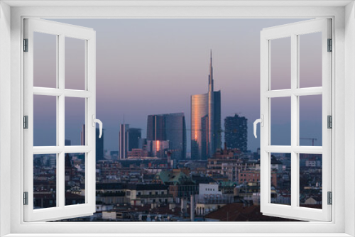 Fototapeta Naklejka Na Ścianę Okno 3D - Milan cityscape at sunset, large panoramic view with new skyscrapers of Porta Nuova district.