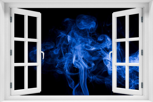 Blue smoke on black background