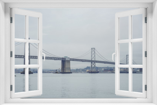 Fototapeta Naklejka Na Ścianę Okno 3D - The beautiful San Francisco Oakland Bay Bridge in a cloudy day